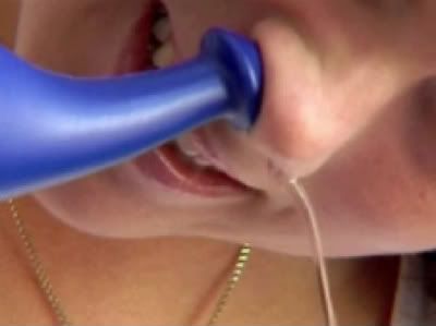 Neti pot in use